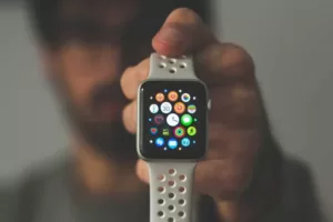 A grey Apple Watch showing installed Apps on the screen, with responsive design ready for 5G