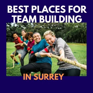 Office workers in Surrey UK are pulling a rope in a team building exercise