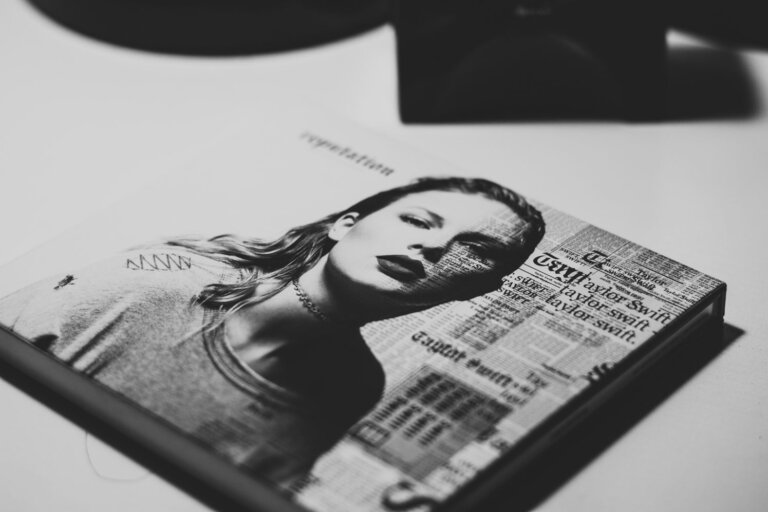 Reviewing brand mentions in publications. A newspaper shows prints of reviews/. mentions