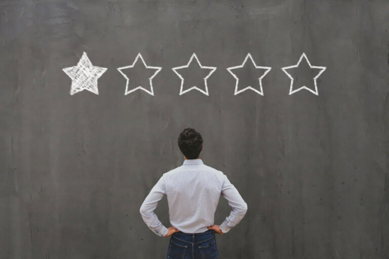 a business owners is reviewing his google reviews to help his brand reputation